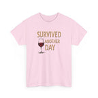Pink t-shirt with a graphic of a wine glass and text 'SURVIVED ANOTHER DAY' on a white background