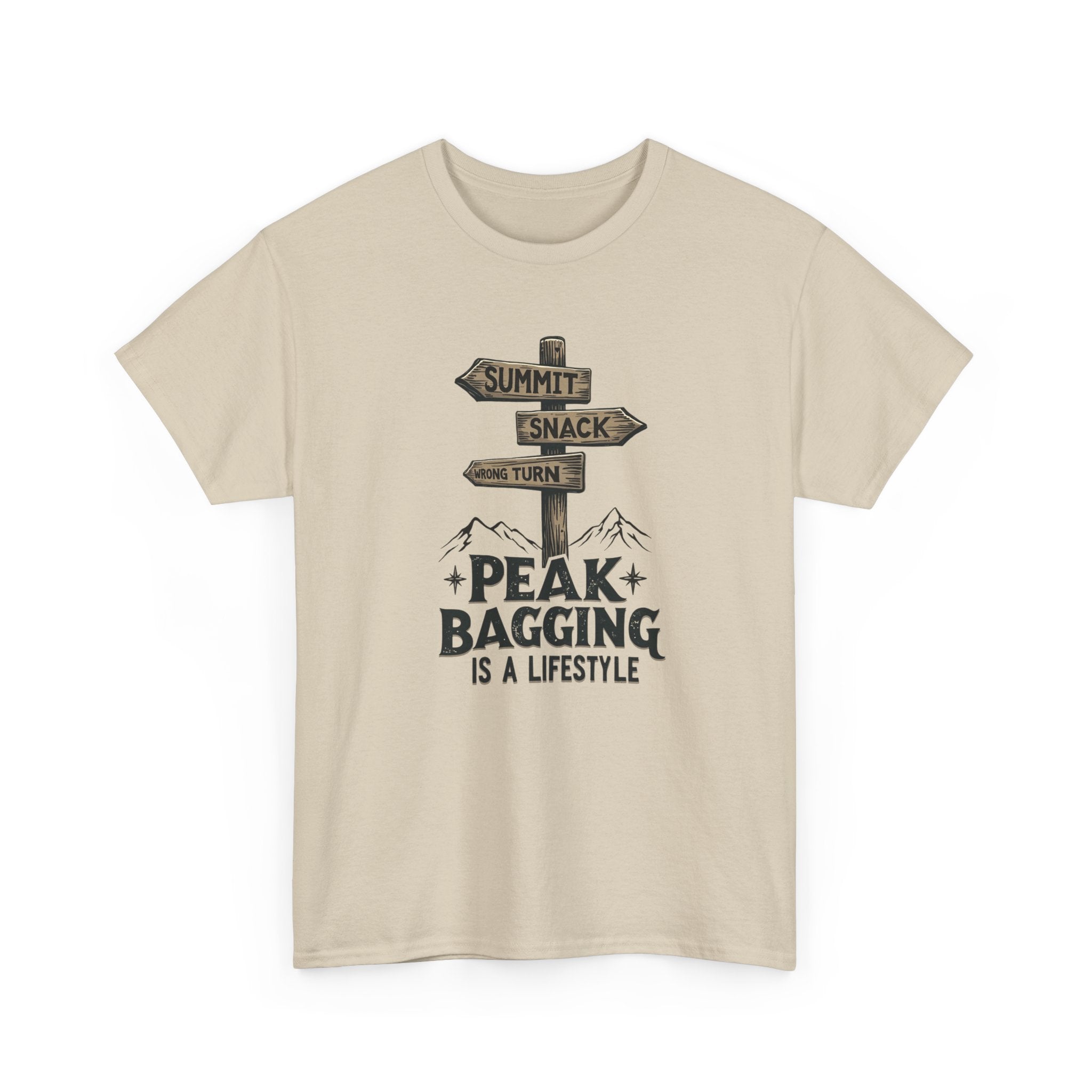 Beige t-shirt with mountain-themed graphic and text 'peak bagging is a lifestyle' on a white background