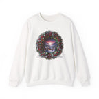 Festive Christmas wreath with holly, red berries, warm glowing lights, and a snowy mountain village scene in the center with the text ‘Merry Christmas