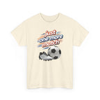 Beige t-shirt with soccer-themed graphic and text 'just one more match' on a white background