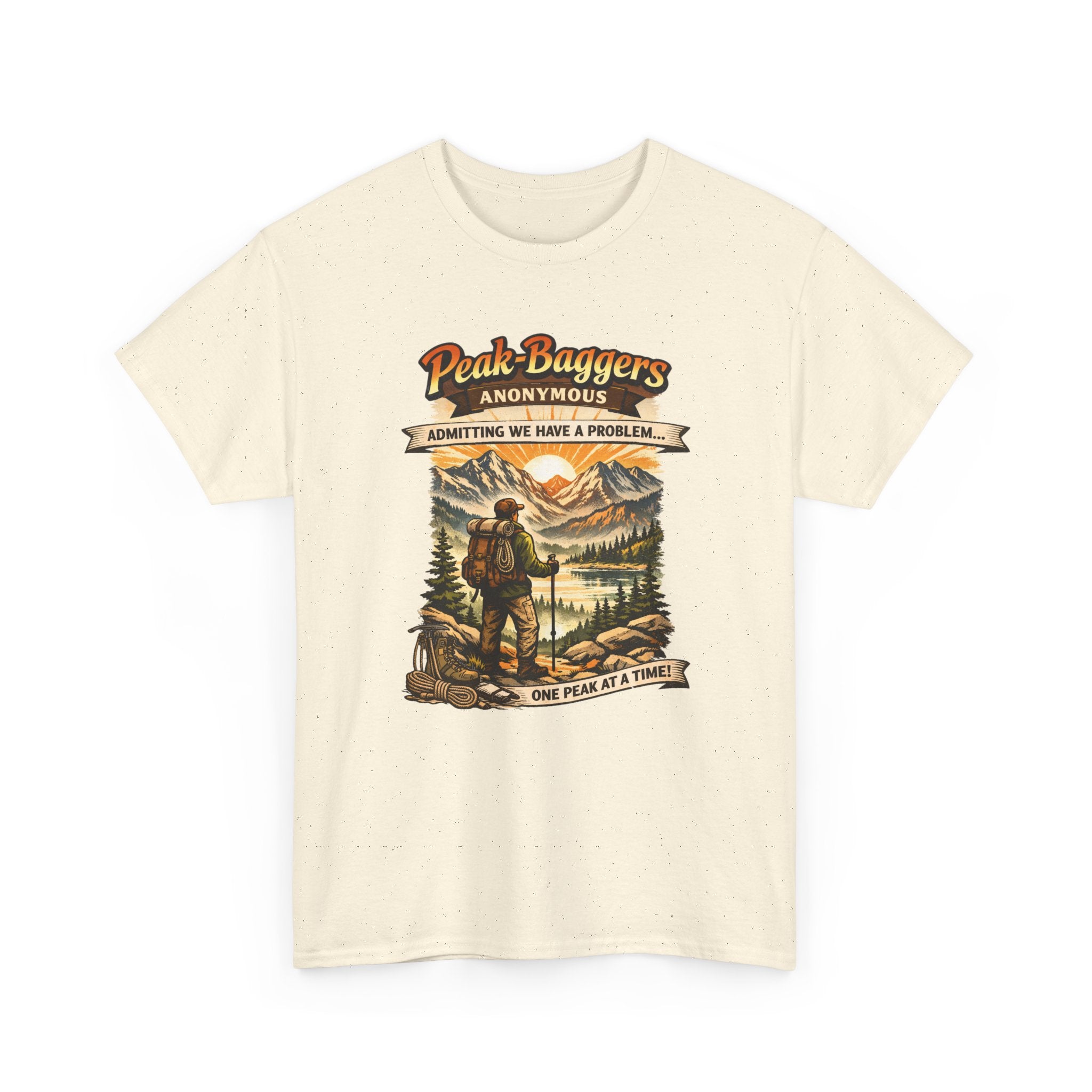 Beige t-shirt with a graphic of a hiker and mountain scene, featuring text 'Peak Baggers Anonymous'.
