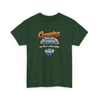 Green t-shirt with funny 'Camping may be cool, but this is a little cooler' graphic on a white background