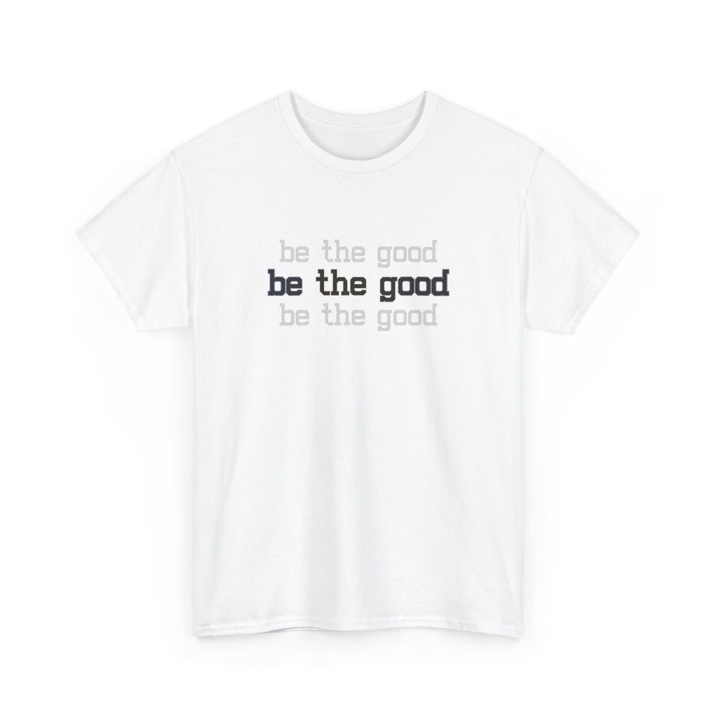 White t-shirt with 'be the good' text printed on a white background