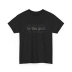 Black t-shirt with 'be the good' text on a white background